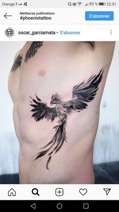 an image of a bird on the side of a man's stomach with tattoos