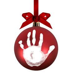 a red ornament with a hand print on it and a bow hanging from the top