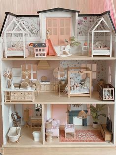 a doll house with all the furniture and accessories in it's display case is shown