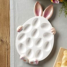 a white plate with pink bunny ears on it