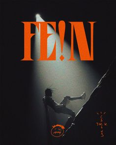 a person climbing up the side of a rock on top of a poster that reads fem