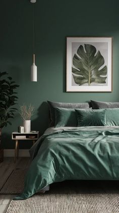 a bed with green sheets and pillows in front of a painting hanging on the wall