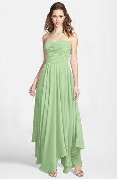 a woman in a strapless green dress