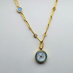 MOONSTONE DIAMONDS SAPPHIRES TURQUOISE SUN SYMBOL GOLD NECKLACE Luxury Pendant Chain Necklace With Charms, Luxury Round Cabochon Necklace, Luxury Blue Medallion Jewelry, Celestial Gold Gemstone Jewelry, Fine Jewelry Round Cabochon Necklaces, Yellow Gold Medallion Jewelry With Adjustable Chain, Luxury Charms Round Pendant Necklace, Turquoise Round Gold-plated Jewelry, Turquoise Gold-plated Round Jewelry