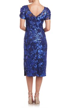 Sparkling sequins and floral embroidery illuminate this cocktail dress designed with an elongating neckline and a diipped back. 42" length (size 8) Hidden back-zip closure Bateau neck Short sleeves Lined 100% nylon Dry clean Imported Blue Floral Embroidered Evening Dress For Party, Blue Floral Embroidery Evening Dress For Party, Blue Evening Dress With Floral Embroidery For Party, Blue Fitted Evening Dress With Floral Embroidery, Fitted Blue Evening Dress With Floral Embroidery, Fitted Midi-length Sequin Dress For Gala, Evening Sequin Dress With Floral Embroidery, Fitted Sequin Dress With Floral Embroidery For Evening, Elegant Evening Sequin Dress With Floral Embroidery