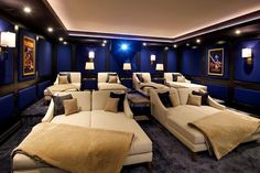 a home theater with couches and chairs