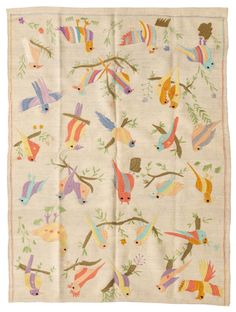 an embroidered cloth with colorful birds on it