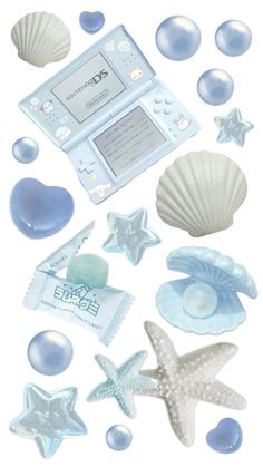 various sea shells, starfish and other items are arranged in the shape of an electronic device