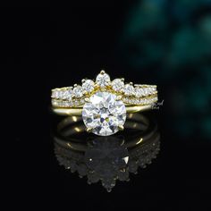 a diamond ring with two rows of diamonds on the top and bottom, set in 18k yellow gold