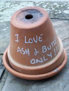 a brown fire hydrant with writing on it