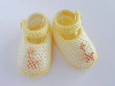 "Looking for a super cute pair of hand knitted baby shoes for that extra special tiny man or lady in your life?  This hand knitted, classic style, pair of baby shoes in yellow and cream with a white and tan gingham giraffe button and functional straps, which will keep the shoes on tiny feet (no more lost shoes when out on the go) will compliment or dress up any outfit in your baby's wardrobe and are a perfect style for both baby girls and boys. With many beautiful designs in both solid, two tone Knitted Baby Shoes, Rebecca Brown, Baby Boy Booties, Knit Baby Shoes, Variegated Yarn, Baby Giraffe, Gift Newborn, Baby Boy Shoes, Crib Shoes