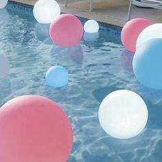 an inflatable ball floating on top of a swimming pool