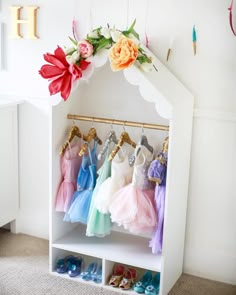 a white shoe rack with dresses hanging on it and text overlay that says how to organize your closet for dress up storage