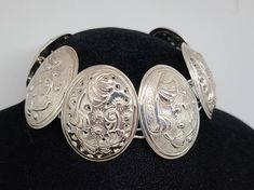 925 Silver Embossed Floral Oval link Panel Bracelet Item w# 1263 Clean and in good condition 7.5 to 7.75 inch fit Elegant Engraved Oval Sterling Silver Bracelet, Traditional Oval Bracelets For Formal Occasions, Silver Oval Link Bracelets For Weddings, Silver Oval Bracelets With Intricate Design, Ornate Oval Engraved Bracelets, Formal Hallmarked Oval Sterling Silver Bracelet, Formal Oval Hallmarked Sterling Silver Bracelet, Oval Bracelet With Sterling Silver Clasp In Silver, Oval Silver Bracelet With Sterling Silver Clasp