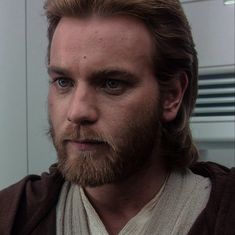 a close up of a person with a beard