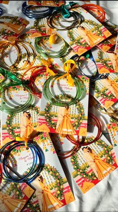 many bracelets and necklaces are laid out on the table