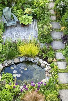 a small garden with a pond and chairs in the center, surrounded by greenery