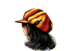 This Rasta Jamaican Bucket hat is perfect for Summer Reggae Festivals. This solid Bucket hat features a Jamaican Rasta Inspired Striped Band atop a solid , Red green yellow Rasta color bucket hat. Rock this hat as you dance the night away at your next outdoor concert or event. Fashionable and a must-have . This Hat is unisex that looks great on both men and women . This Hat is very durable and can be used as a special gift . -Solid Unisex Jamaican Adult Sun Hat -Rasta Reggae Inspired Striped Ban Retro Cap Hat One Size, Retro One Size Cap, Retro One-size Cap, Vintage Baseball Cap For Festivals, Adjustable Flat Cap For Festivals, Adjustable Multicolor Flat Cap, Retro Festival Cap Style Hat, Vintage Festival Baseball Cap, Vintage Multicolor Flat Cap