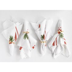 four napkins with christmas decorations on them