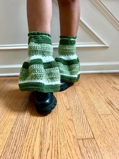 Introducing our one-of-a-kind crochet legwarmers in enchanting shades of green. These legwarmers are not just an accessory; they're a statement piece that adds a touch of whimsy and style to any outfit. They offer both comfort and flair, measuring 14 inches in length and designed to fit snugly around a 16-inch or smaller calf. As you slip on these unique legwarmers, you'll feel an instant boost of confidence and charm. The varying shades of green create a captivating visual effect, while the crochet texture adds a cozy warmth to your legs. Whether you're dancing at a music festival, lounging at home, or running errands around town, these legwarmers will be your go-to choice, elevating your look with their playful elegance. Crafted from 100% acrylic yarn, these legwarmers are not only styli Green Platform Boots, Green Leg Warmers, Boots Leg Warmers, Crochet Legwarmers, Melanie Concert, Leg Accessories, Wishlist Board, Crochet Texture, Crochet Green