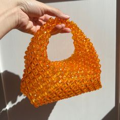 🌸 Elegant and Stylish: The handmade orange bead bag is the perfect choice to add elegance and style to any occasion. With its shimmering bead details, this bag complements every style and elevates every outfit. 👜 Functionality Meets Elegance: This bag offers both elegance and practicality. Crafted with intricate details, this design can be used for everyday wear as well as for special occasions, making it a versatile accessory. 🌸Size: 25cm x 20 cm. This bag is spacious enough to hold your pho Handmade Orange Evening Bag, Handmade Orange Handheld Shoulder Bag, Handmade Handheld Orange Shoulder Bag, Beaded Orange, Hand Beaded Bag, Grunge Accessories, Orange Crystals, Pearl Bag, Beaded Bag