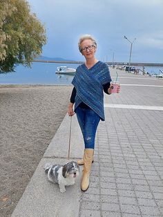 a woman walking her dog on a leash