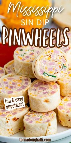 a plate full of ham and cheese pinwheels with text overlay that reads, mississpei sin dip pinwheels