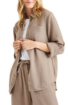 Made from gauzy cotton, this long-sleeve button-up blouse is sure make the capsule-wardrobe cut. 28" length Spread collar Long sleeves with button cuffs 100% cotton Machine wash, line dry Imported Long Sleeve Shirt With Button Closure For Daywear, Cotton Long Sleeve Blouse With Button Cuffs, Neutral Button-up Cotton Blouse, Neutral Cotton Button-up Blouse, Beige Long Sleeve Blouse With Button Closure, Relaxed Fit Long Sleeve Blouse For Loungewear, Beige Shirt With Button Cuffs For Daywear, Summer Long Sleeve Shirt With Covered Buttons, Summer Long Sleeve Blouse With Button Cuffs