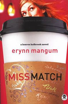 a cup of coffee sitting on top of a table with the words miss match written on it