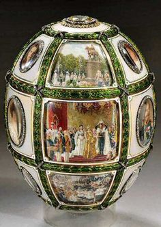 an elaborately decorated glass ball with pictures on it