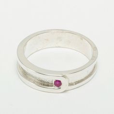 "A Solid Gold Gents ring set with a Genuine Natural Ruby. This colorful Ruby adds a touch of color to the subtle elegant design of the ring. This is a delightful piece to wear, comfortable and easy to wear. The band measures 6.5mm (0.26\" inches) North to South and would work very well as an alternative mens wedding band. The inside of the shank has a marking, this is the Full Hallmark made by the Assay Office - This mark includes the purity mark .417 and the unique symbol of the Assay Office. T Ruby Mens Wedding Band, Mens Band Rings, Gents Ring, Rings Mens Wedding Bands, Mens Band, Natural Ruby, Mens Wedding Bands, Yellow Rose, Wedding Men