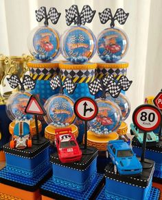 cars themed birthday party with cake and cupcakes