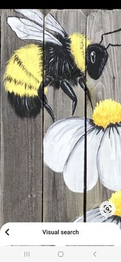 an image of bees and flowers painted on wood