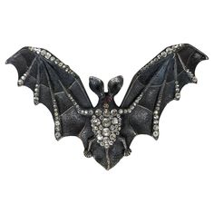 Extraordinary 19th Century Paste Bat Buckle, Museum exhibited at the Fashion Institute of Technology exhibition "Goth, Dark Glamour" in 2008. Massively scaled Victorian bat in patinaed bronze, beautifully detailed with hand set pastes and faux ruby cab eyes. Huge scale and rare subject matter. 1860's. 5.25" x 3". Dark Glamour, Fashion Institute Of Technology, Fashion Institute, Museum Exhibition, The Fashion, 19th Century, Bat, Fashion Accessories, Pasta