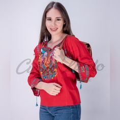 Look Fan-Tas-Tic In This Stunning Mexican Blouse! Embroidered With A Vibrant, Colorful Peacock Design, This Beauty Will Make Heads Turn. Plus, It's Tailored With A Comfy V-Neck, 3/4 Sleeves, And Tassels, All Crafted With A Breathable Cotton Blend And Matching Accents For A Poppin' Look. Make 'Em Quack In Envy! Photos Shown Are A Representation Of The Blouse You Will Receive, Fabric Color Is The Same But Embroidery Color Or Design May Vary. This Is Because Each Blouse Is Individually Handmade Whi Red Floral Embroidered Top, Casual Red Cotton Embroidered Top, Red Embroidered Blouse For Fall, Traditional Red Blouse For Fall, Fall Embroidered Red Blouse, Casual Red Blouse For Festival, Red Folk Blouse For Fall, Colorful Peacock, Mexican Blouse