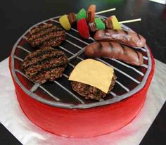 a red cake with hamburgers and hot dogs on it