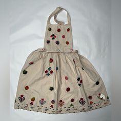 This Anthropologie Women's Chef Apron Is A Stylish Addition To Any Kitchen. Made Of 100% Cotton, It Features A Beautiful Multicolor Floral Pattern That Is Sure To Brighten Up Any Dining Table. The Apron Is Embroidered With A Vintage/Retro Style, Making It Perfect For Both Casual And Formal Occasions. The Apron Is One Size Fits All And Is Ideal For Women Who Enjoy Cooking And Entertaining. It Is Perfect For Use In The Kitchen, At Backyard Barbecues, Or During Any Multipurpose Occasion. Made In In Casual Cotton Dresses For Festive Occasions, Casual Embroidered Dress For Festive Occasions, Anthropologie Apron, Apron Women, Female Chef, Embroidered Apron, Chef Apron, Anthropology, Modest Dresses