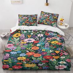 a bed with colorful flowers and plants on it