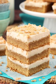 a stack of cake sitting on top of a blue napkin