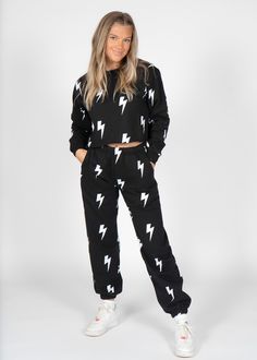 Your new go to pair of sweats, perfect for these lazy quarantine days, while still looking super trendy and cute! Offered in both stars and lightning with a matching crop top for the ultimate set Model is 5'5 Model is wearing a S Sizing is standard 60% cotton / 40% polyester for ultimate softness Adjustable waist drawcord, covered elastic waistband and cuffs, & pockets Comfy Letter Print Sweats For Loungewear, Cotton Crop Top For Winter Loungewear, Relaxed Fit Letter Print Comfy Sweats, Comfy Sweats With Letter Print In Relaxed Fit, Sporty Sweats With Relaxed Fit And Letter Print, Trendy Cotton Crop Top For Loungewear, Trendy Black Crop Top For Loungewear, Lightning Bolt Sweatpants, Football Tailgate