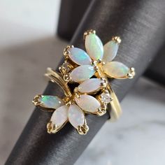 A Unique Women's Vintage Estate 14k Gold Opal & Diamond Floral Ring. The Ring Is A Size 6.0, And Weighs 7.7g. The Length Of The Ring Is 7/8" There Are About .04cts Of Diamonds. Ring Is Marked. Not Sure If Opals Are Natural Or Man Made. The Ring Makes A Beautiful, Gift For That Someone Special. Any Questions, Please Ask. Be Sure To Check Out Some Of My Other Great Items Up For Sale. Thank You. Floral Ring, Diamonds Ring, New People, Womens Jewelry Rings, Rings Statement, Floral Rings, Statement Rings, Vintage Ladies, Jewelry Watches