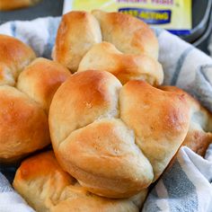 some bread rolls in a basket on a table