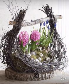 a bird nest filled with flowers and twigs