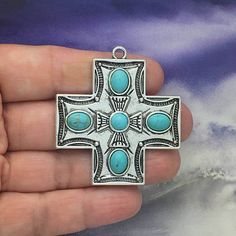 You will receive BULK 3 - Large Southwestern Cross Charm with Turquoise stones in Antique Silver Pewter by TIJC. These charms are a quality Silver for all your jewelry and crafting projects! - (3) Cross Pendant Pewter - 48x44mm ( 25.4mm = 1 inch ) - Quality Pewter Alloy - Item # SP1251B Use to Make Silver Cross Necklace Southwestern Jewelry All Items will come as shown in a poly bag! WE ARE LOCATED IN TEXAS. WHICH MEANS YOU RECEIVE ITEMS QUICKLY IF IN THE U.S! WE ALSO SHIP INTERNATIONALLY All it Island Jewelry, Silver Cross Necklace, Boot Bling, Turquoise Cross, Gold Cross Pendant, Southwestern Jewelry, Turquoise Stones, Cross Jewelry, Cross Charms