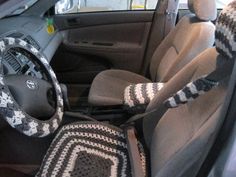 the interior of a car is decorated with black and white crochet