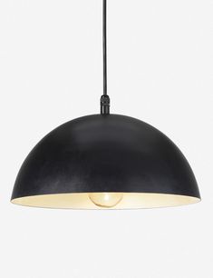 a black pendant light hanging from a ceiling