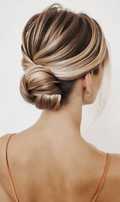 Woman with a Bun Hairstyle Low Bun Wedding Hair, Side Bun Hairstyles, Wedding Bun Hairstyles, Twisted Hair, Elegant Bun, Chignon Hair, Low Bun Hairstyles, Bridal Hair Buns, Hair Knot