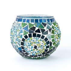 a glass vase that has been decorated with many different colors and designs on it's sides