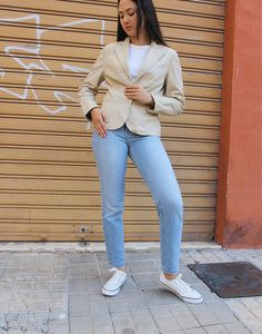 Leather blazer in cream. Snap fastenings. Size M.EU 38-42 / UK 10-14. Measurements - 38"(97cm) bust - 25"(64cm) sleeve length - 24"(61cm) jacket length. Material - Real leather. Condition - Excellent. Sustainability - Vintage. Handpicked, repaired and ready to wear. This is an original vintage item, not new and minor signs of wear and age are expected, we will highlight any major flaws. Model is a UK 6/8 and is 5'7" tall Tailored Cream Blazer For Work, Cream Fitted Blazer For Business Casual, Fitted Cream Blazer For Business Casual, Cream Blazer With Single Button And Lapel Collar, Cream Lapel Collar Blazer With Single Button, Cream Single Button Blazer With Lapel Collar, Cream Fitted Blazer For Work, Cream Blazer With Lapel Collar For Office, Fitted Cream Blazer For Work