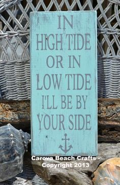 there is a sign that says, high tide or in low tide i'll be by your side